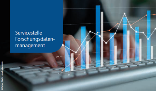 Balkendiagramm über einer Computertastatur mit Händen