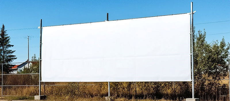 Picture of a large white screen standing outside
