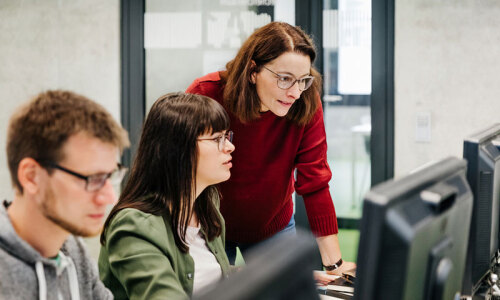 Researchers behind their computers