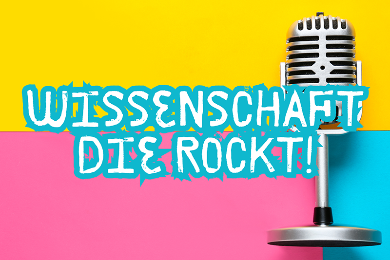 Plakat mit Mikrofon und Aufschrift: Wissenschaft, die rockt!