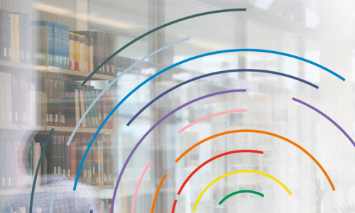 Bookshelf seen through a pane of glass with rainbow design